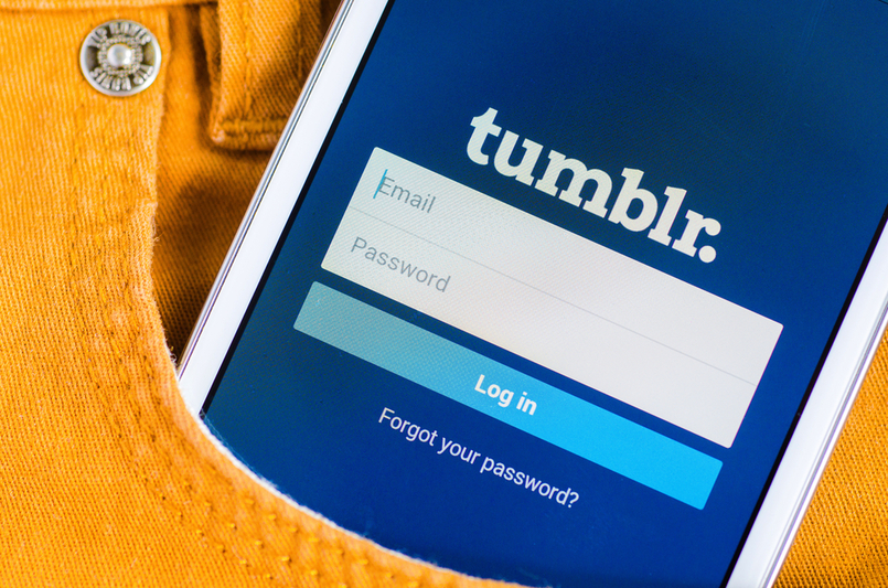 LVIV, UKRAINE - May 19, 2015: white Samsung Smart Phone with Tumblr social Network Log In Screen in the pocket of orange jeans